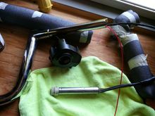 TBW sensor wires going into the bars.  The wires came through the bars pretty easy, but remember push the wires first and then pull on the weed whacker line.