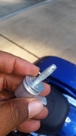 the new saddle bag connector bolt. its threaded, but I didn't bolt it all the way up. the handle points upward when you take it all the way up