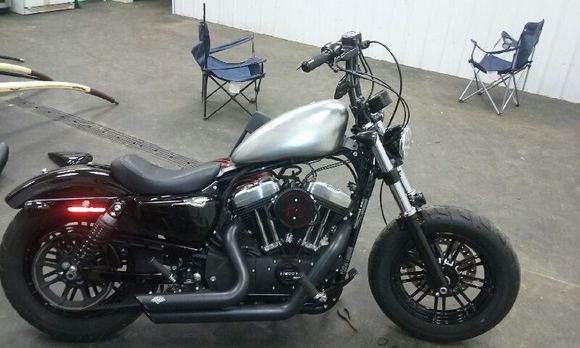 Well i started my wire tuck, ignition and coil relocation this evening but didn't finish. I couldnt find my tape or zipties. Imagine that! But i set my tank to check out how she would fit and i like it. I have a question though. Directions say to seal the tank which i will, but it says to have it pressure checked also. Where can i have it pressure checked at? Oh, just noticed the reflector on the back. Its gotta go.