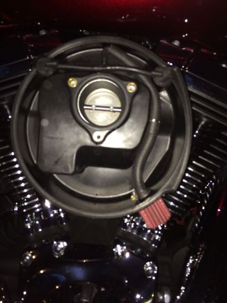 Then took a 5/16 hose to snuggly fit over the air cleaner tube and placed a 1/4 to 1/2 barbed union about halfway down, and attached a piece of 3/8 to fit over the breather inlet which is placed at about the 5 o'clock position on the air box.