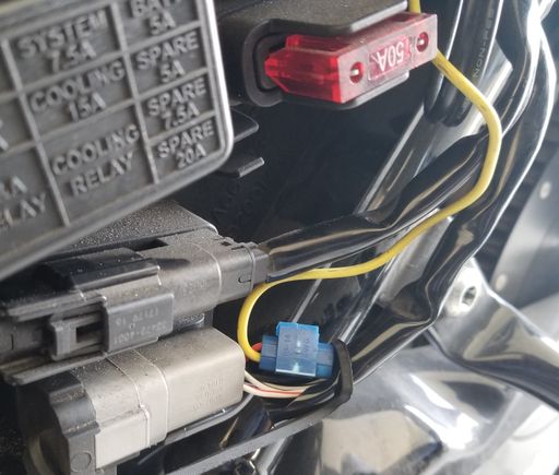 Yellow wire spliced into a red/yellow wire, that is a switched power source, just behind the unused P&A connector.