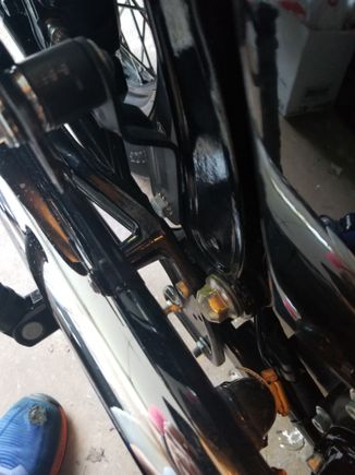 Picture shows stock exhaust mount point with passenger peg.