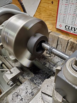 Boring the fork stop donuts on the lathe.
