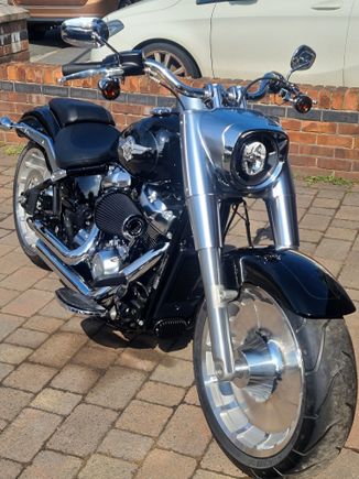 Monster Sucker on my Stage 2 114 FatBoy,runs close to my leg when riding but does not distract from riding. Im 5'10" in height.
