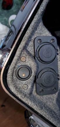 the small button is for a LED that lights the inside of the pack 