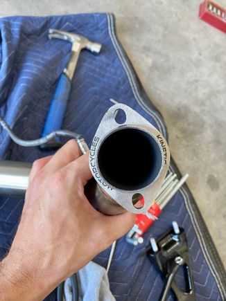 Incorrect logo orientation on front pipe (logo facing cylinder head)
