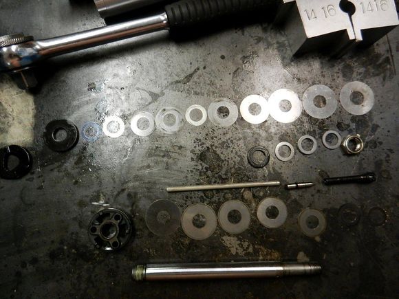 Rebuilding a HD-159 Ohlins shock before cleaning the shim stack.  Look at the dirt.