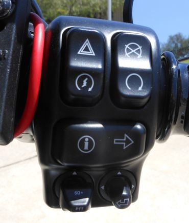 The right handlebar switch pack nopw includes a push-to-talk button for use with the CB.  It is a switch pack for prior '19 models, but works on the '19, but has the wrong symbol on Infotainment return button.  I know what it does so it does not bother me. BTW, the red wide is the power to my phone from the connection located inside the little cubby compartment. 

 