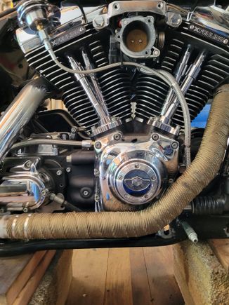 When the heat shields are back on you can hardly notice the wrap. I know it stops the heat damage to the reflector and hopefuly keeps the new cam cover from simmering until done.