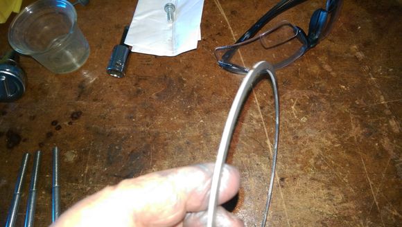 Spacer is stamped, sharp edges facing out. 