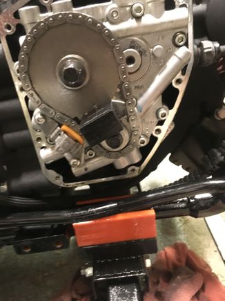 Next reinstall the sprockets and chain/tensioner. I found it easier to set the timing marks with the gears in the chain, and then install the locking tool, then install the gears to the cam plate. The locking tool only fits one way, and I highly suggest buying it.