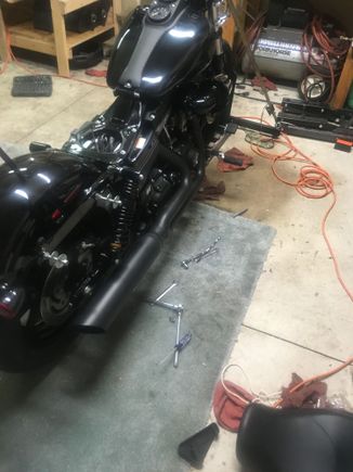 Slide on the pipe and bracket and tighten down the 3 bracket bolts and 2 pipe to bracket nuts.