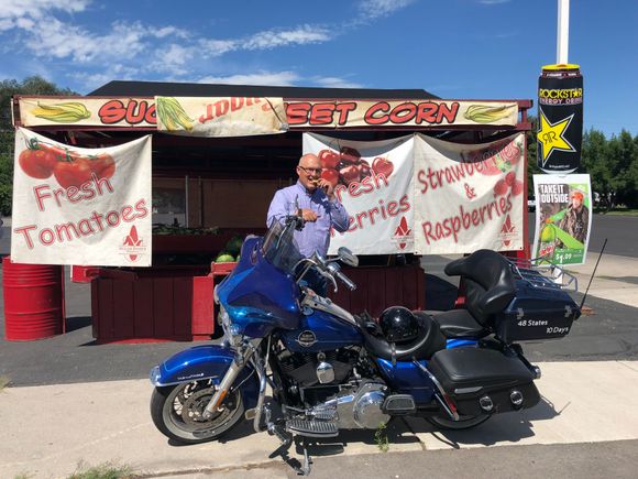 Most of our local stands focus on sweet corn.  Fruit is kind of a sideline for some of them.  I can't say the melon she was sampling is my favorite fruit, but it looked better than the peaches and apricots she had and I wasn't really hankering for cherries or the berries either.