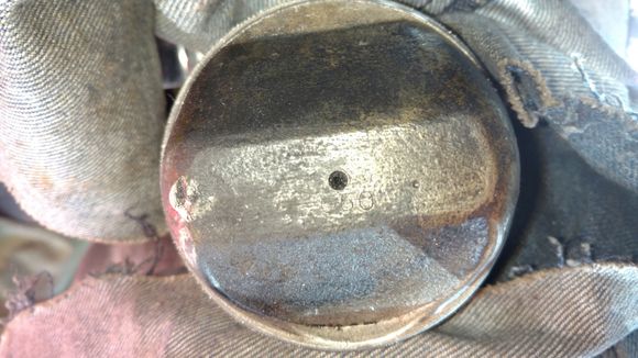 Only a small ding from the spark plug.  not too much damage considering how much slop was in the crank pin bearings.