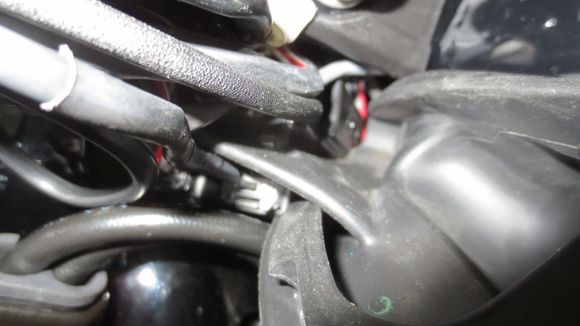 The rubber grommet in the frame with the connectors