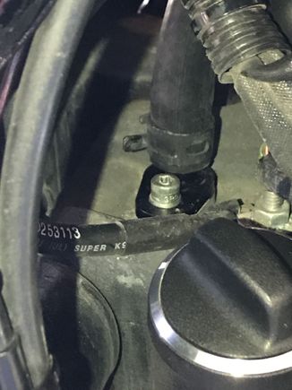 Oil return fitting with 1/2" hose attached to top of transmission