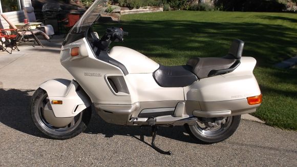 I have a Honda Pacific Coast. I've never even considered trying to run a car tire on it. there's not that much room under there and bike tires are not too expensive (if you run 140 -90-15 instead).