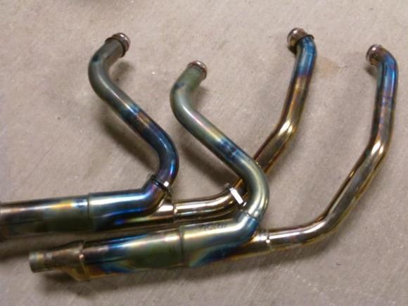 Front header with cat, rear one no cat. Rear header is bluer at rear cylinder, my mileage kept increasing and heat management kicked in earlier indicating leaning of the rear cylinder. Switch back to stock and all is back to normal.