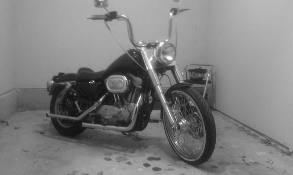 Sportster with fatboy front end, 21 inch wheel with white wall.