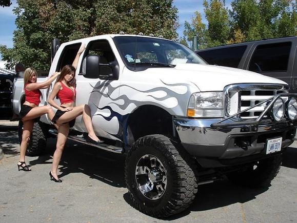 Some girls from a local strip club posing by my truck at the Indy 4X4 Jamboree