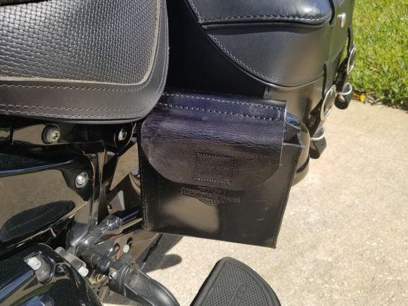 Custom made Puck Holster mounted on Saddlebag Guard