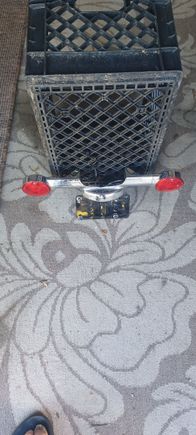 Rear turn signal bar/ license plate bracket. wires to LP light is cut.$ 20