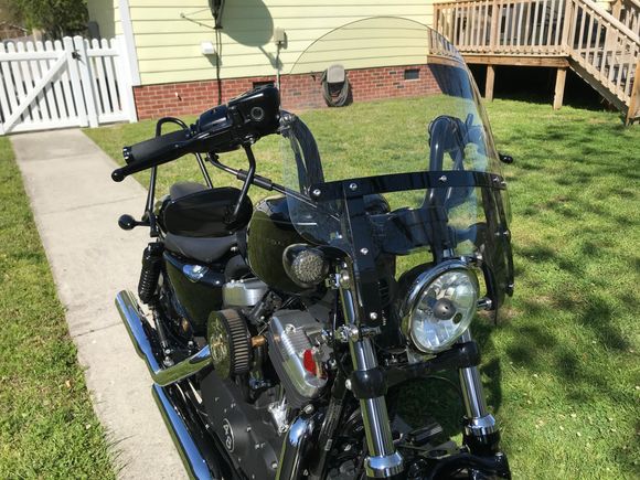 Added a HD quick release windshield to my 48. It really does a nice job cutting the wind without noticeable buffeting.  