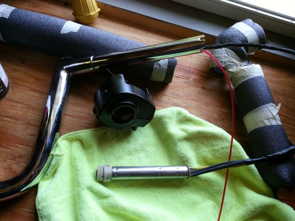 TBW sensor wires going into the bars.  The wires came through the bars pretty easy, but remember push the wires first and then pull on the weed whacker line.