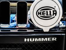 Hella 700FF Driving Lamp mounted to brush guard and white hummer lettering inset in bumper