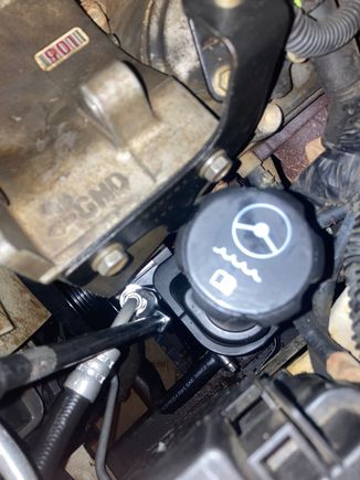 Tight fit, but with a 17mm crows foot, it's manageable.  