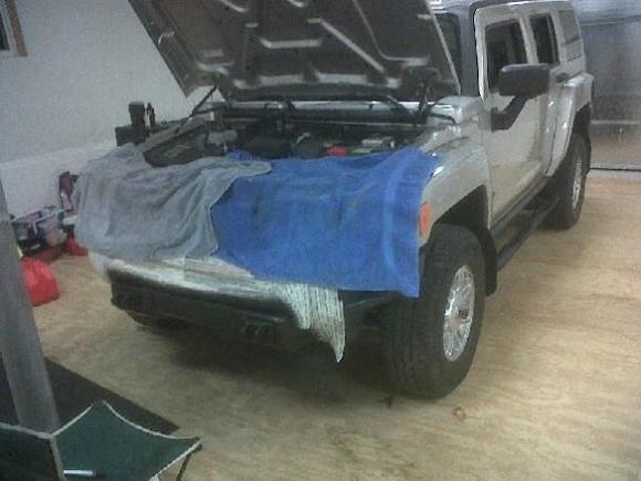 Painting the lower bumper area from silver to flat black.