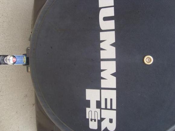 spare tire with the back up cam installed. also a nice tow hitch