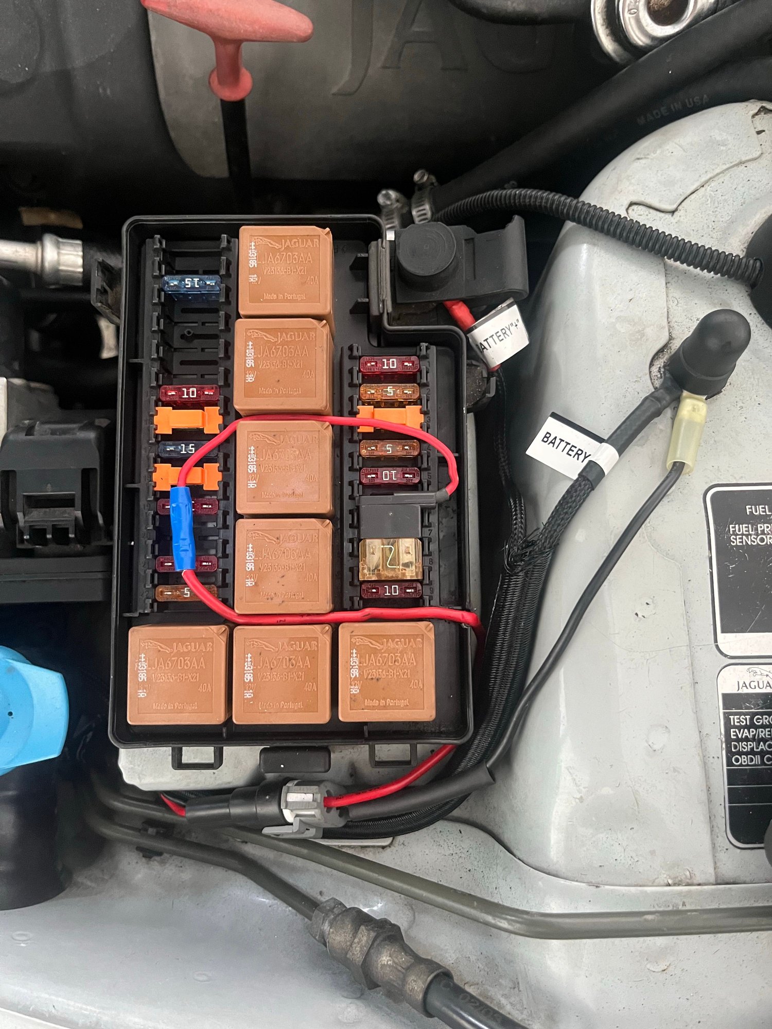 Which is why I opted for this arrangement. It doesnt splice into the factory wiring. Instead, a fuse tap on fuse #6 receives the positive electrical signal sends a positive charge to the OE Valeo ballast that goes on to then power the HID in normal circumstances.
