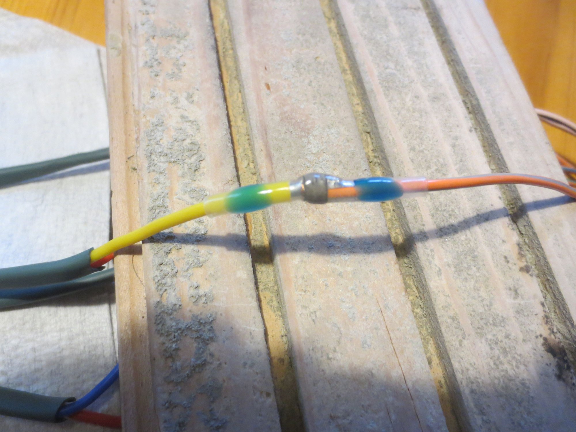 New loom solder tubed to plug pigtail. The free ends were loaded with the outer shrink tube and the solder tube, then the wires twisted together and the tube slid up.