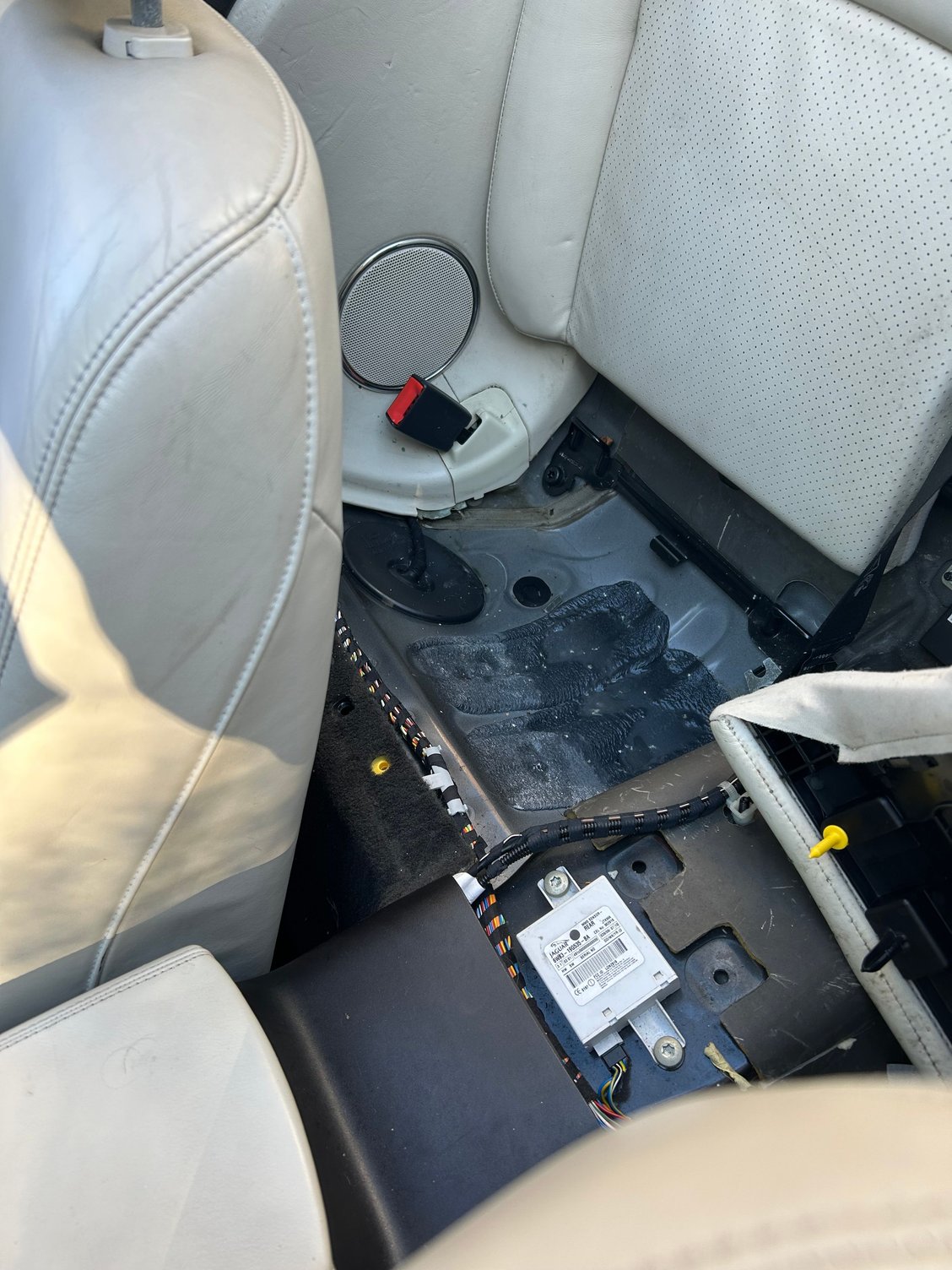 rear seat pooling of water 