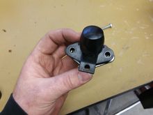 Oem piece with a vacuum cap on top of the focus block off plate so you can see the size difference