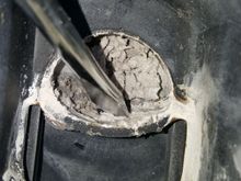 I used a flat head screw driver to see if I can easily remove that stuff.