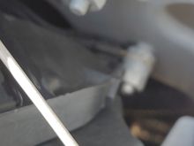 Passenger side (LHD) behind headlight 2006 XJ8.