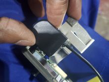 I didn't want to fully rid of this aluminum part. I  lined the camera to trace around it..then used snips to cut it out. I made remove the case of the camera also. Its sealed inside and has half and inch of hollow space. Plus it will not be exposed to the weather.