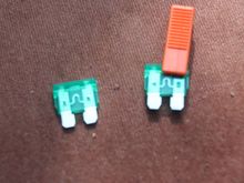 Checking the 2 X 32 amp Fuses to make sure that they were OK (that orange colored 'thingy' is a clip to pull them out with)