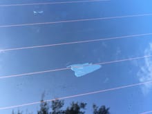 This is the rear convertible window with a sizable chip out of the inside glass tinting. Should I pull it all off and have it totally redone or can it be repaired?