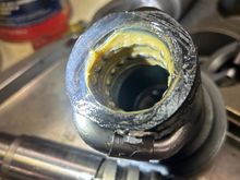 The ball bearings are held to the inside of the piston by grease