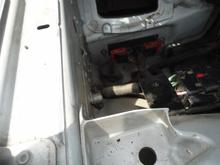 Ground stud almost centered in photo and two ECM connectors