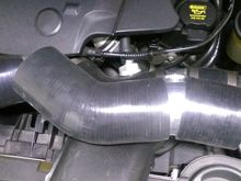 On the early TCP intake the 5/8 vacuum line is plummed into the right intake hose while in the updated version it's plummed into it' own metal sleeve.