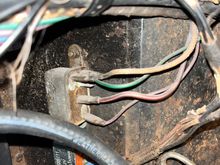 the two relays on the left wheel well.