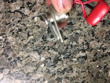 You can see there is no room to correctly use the flat nut with this arm in place.
