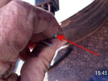 arrow pointing to corrosion on ends of the broken wire