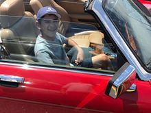 A very happy 14 year old getting into "his" car.