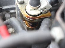 Goo was formed by Petrol from a leaking FPR dissolving the Wax inside the Thermal Switch and then it dripped down onto the Injector where it then 'Cooked' in the Heat from the Inlet Manifold