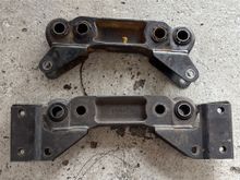 The hole sizes are different, the new bracket will have to be drilled in order to fit on the differential studs